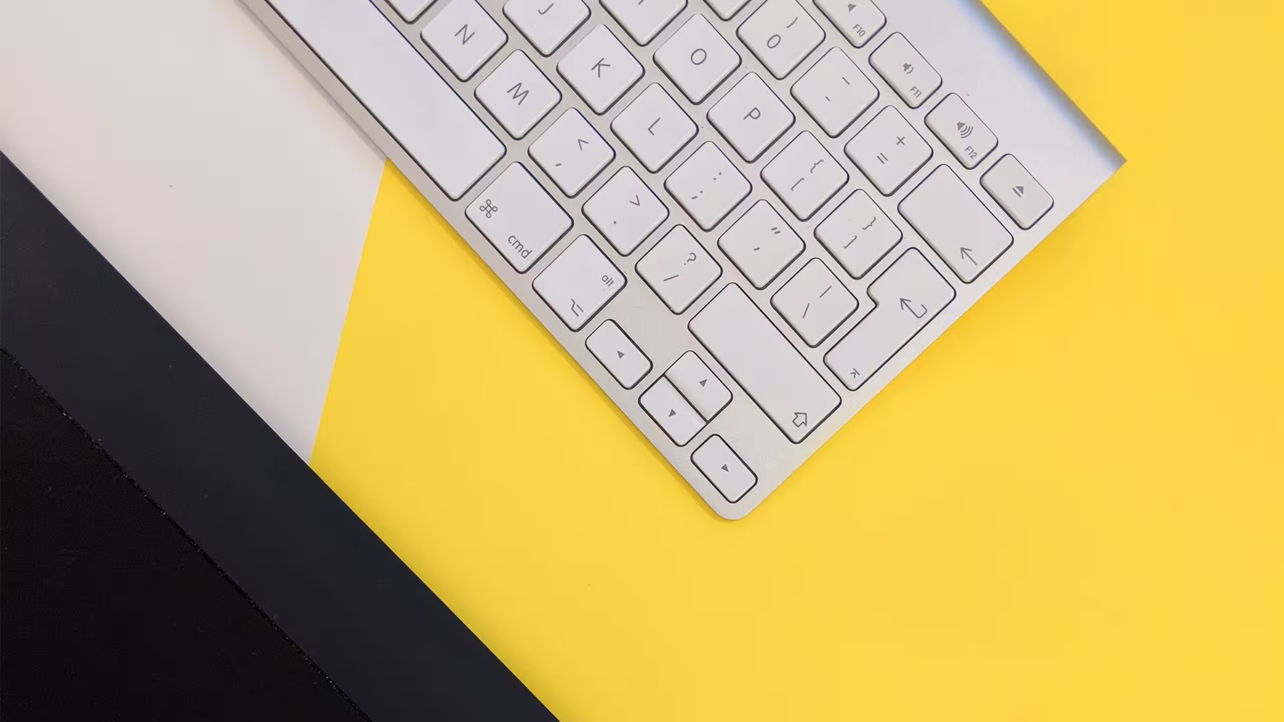 Top-down of a desk that shows a keyboard.