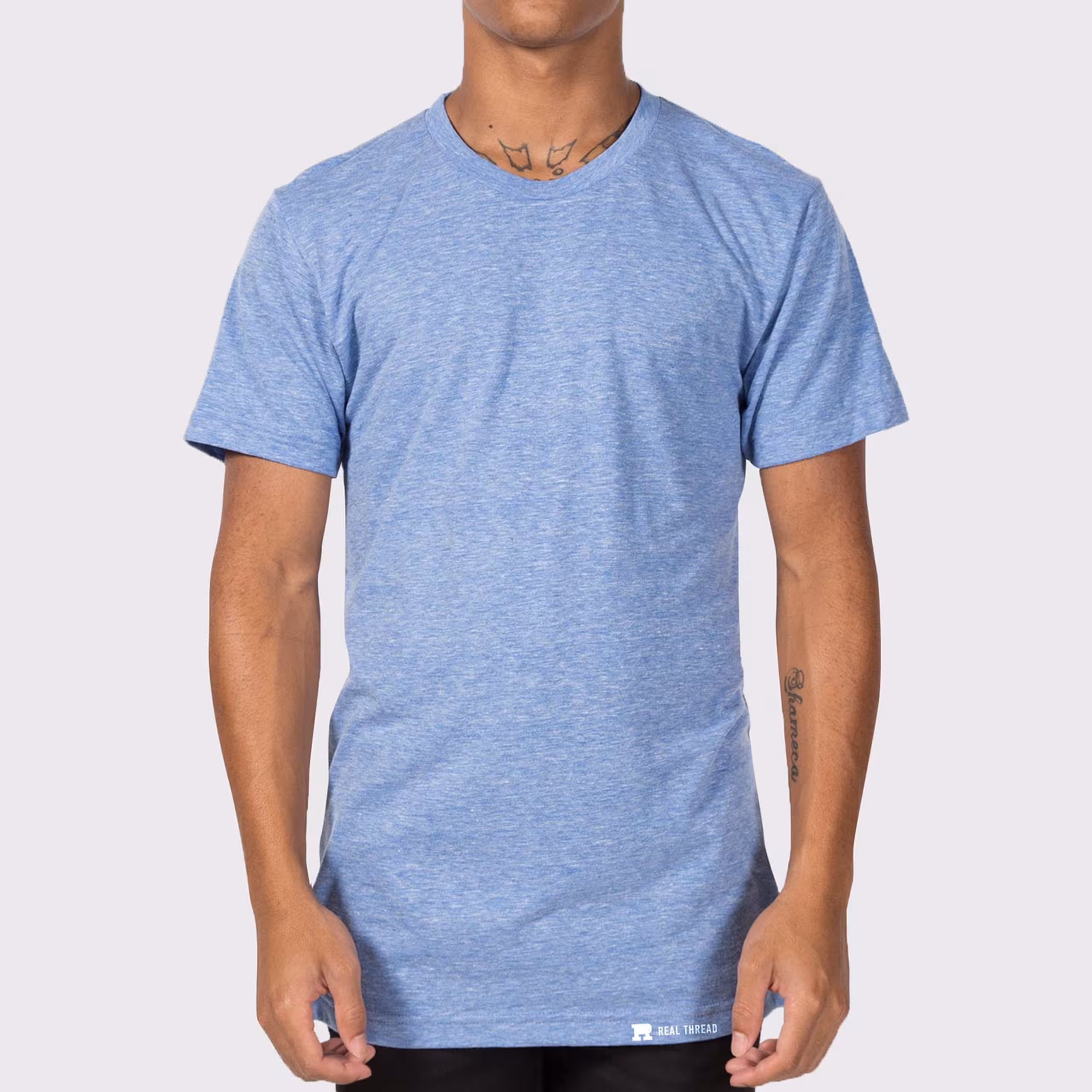 a man wearing a light blue tri-blend t-shirt