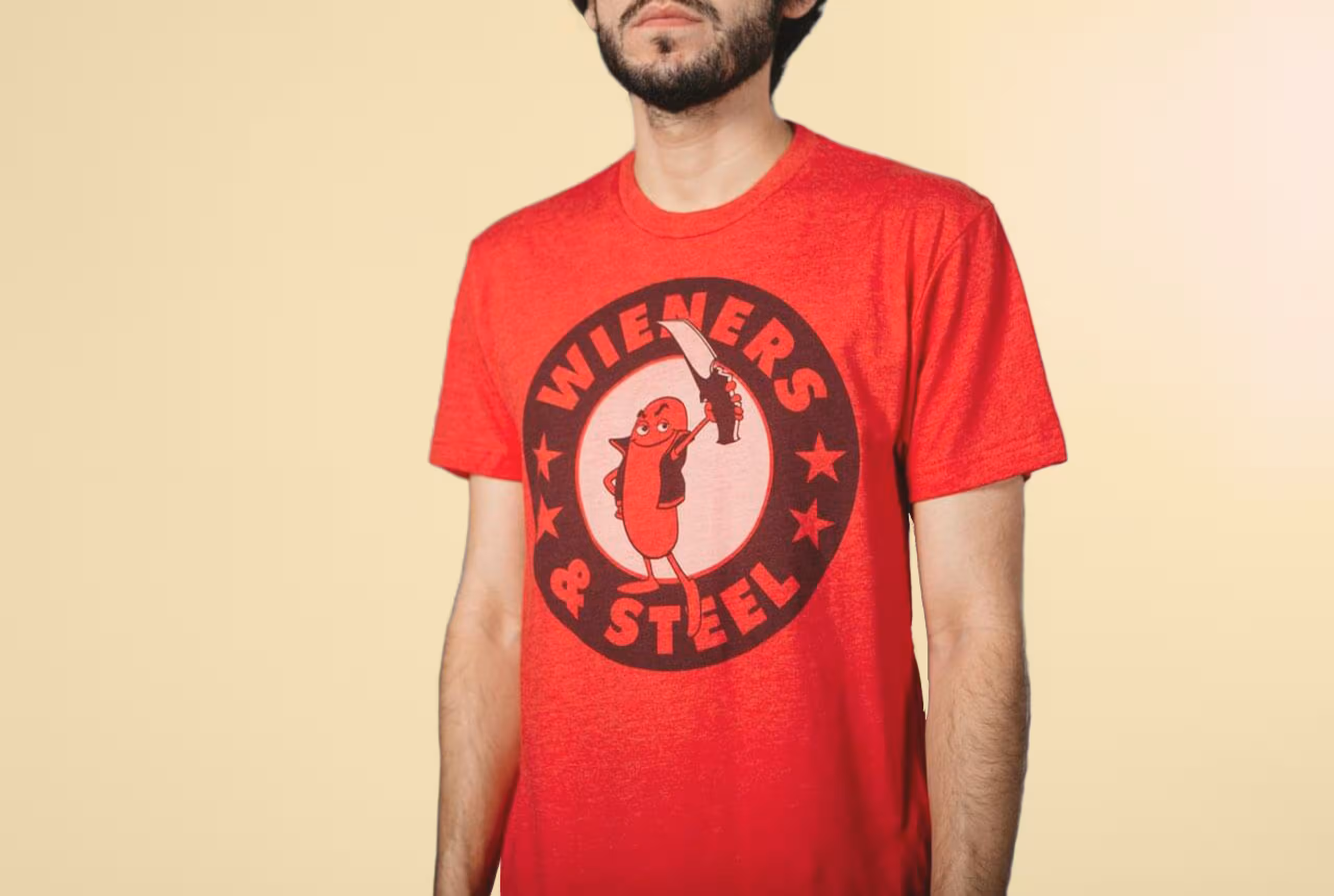 Man wearing red t-shirt with tonal dark and tonal light printing