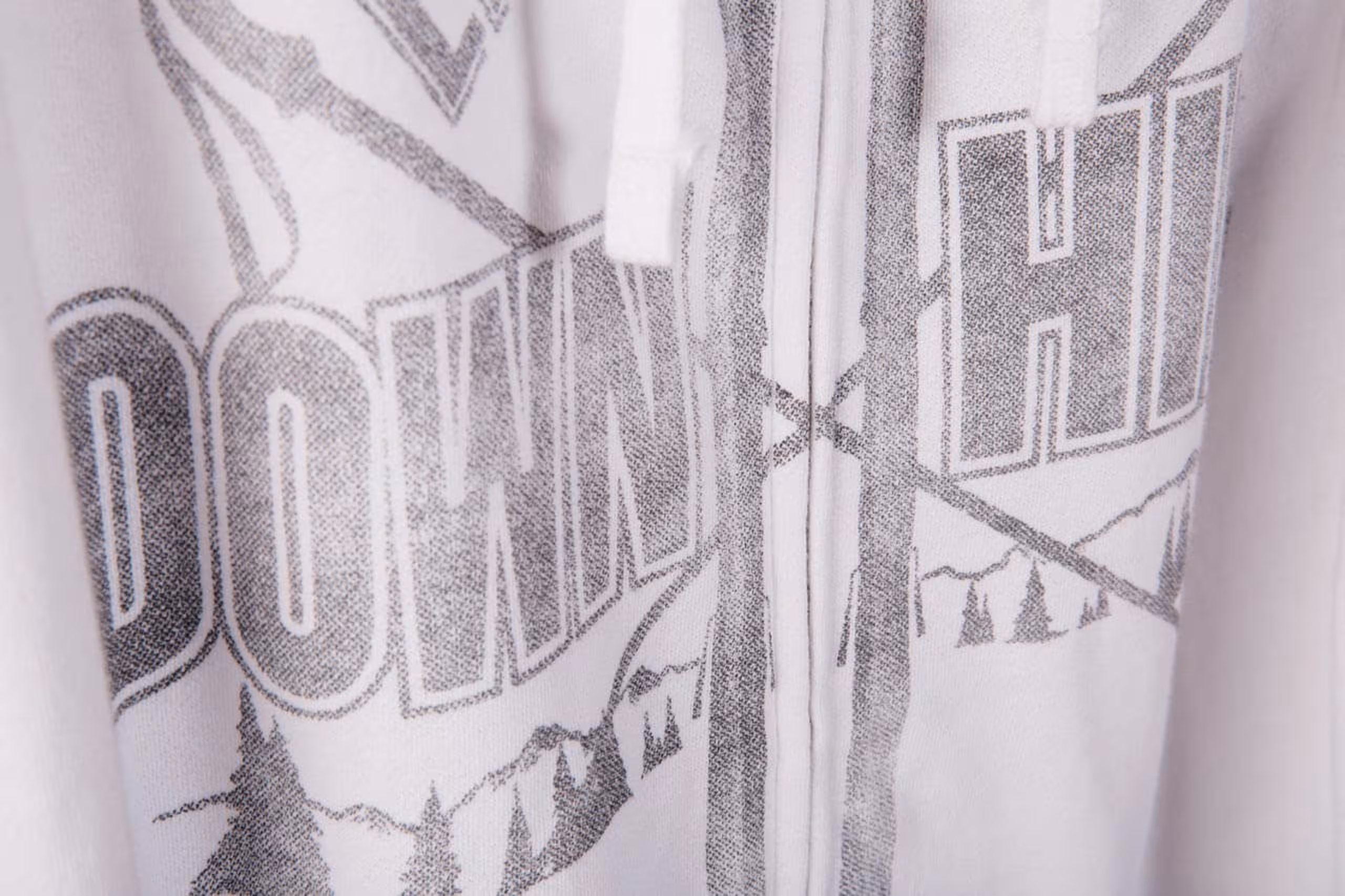 white sweatshirt with gray over the zipper printing 