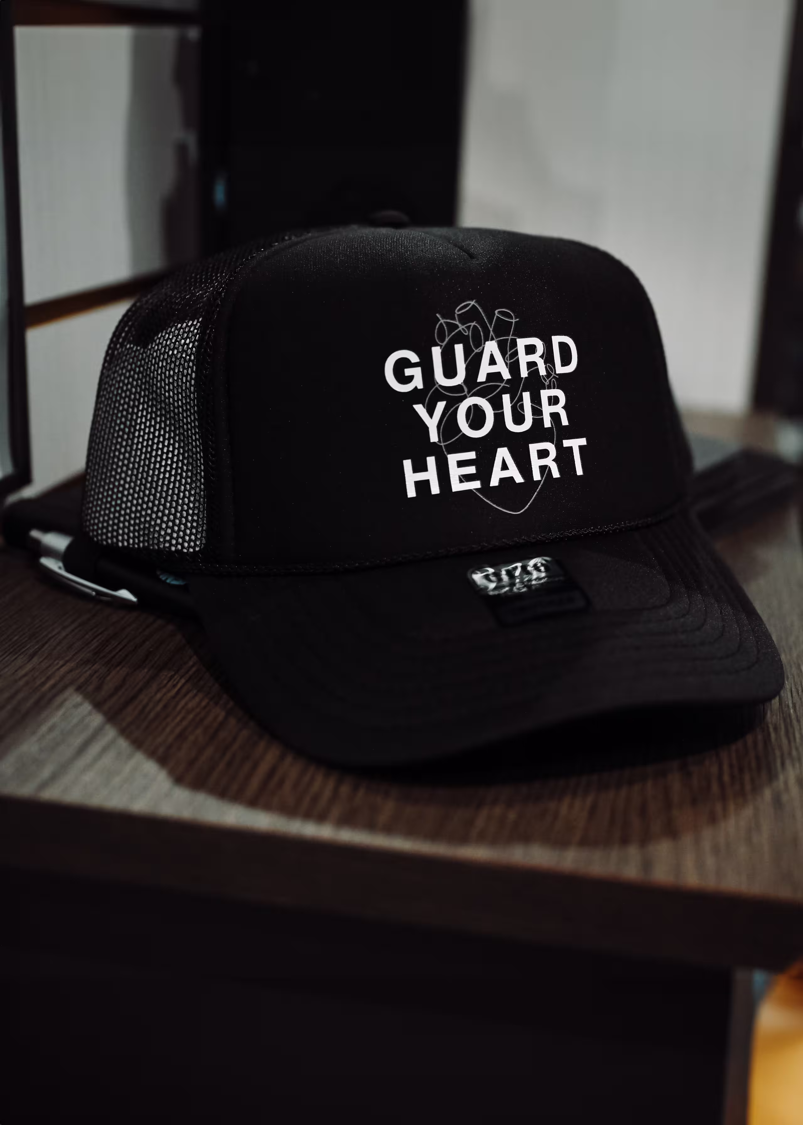 black hat sitting on a shelf