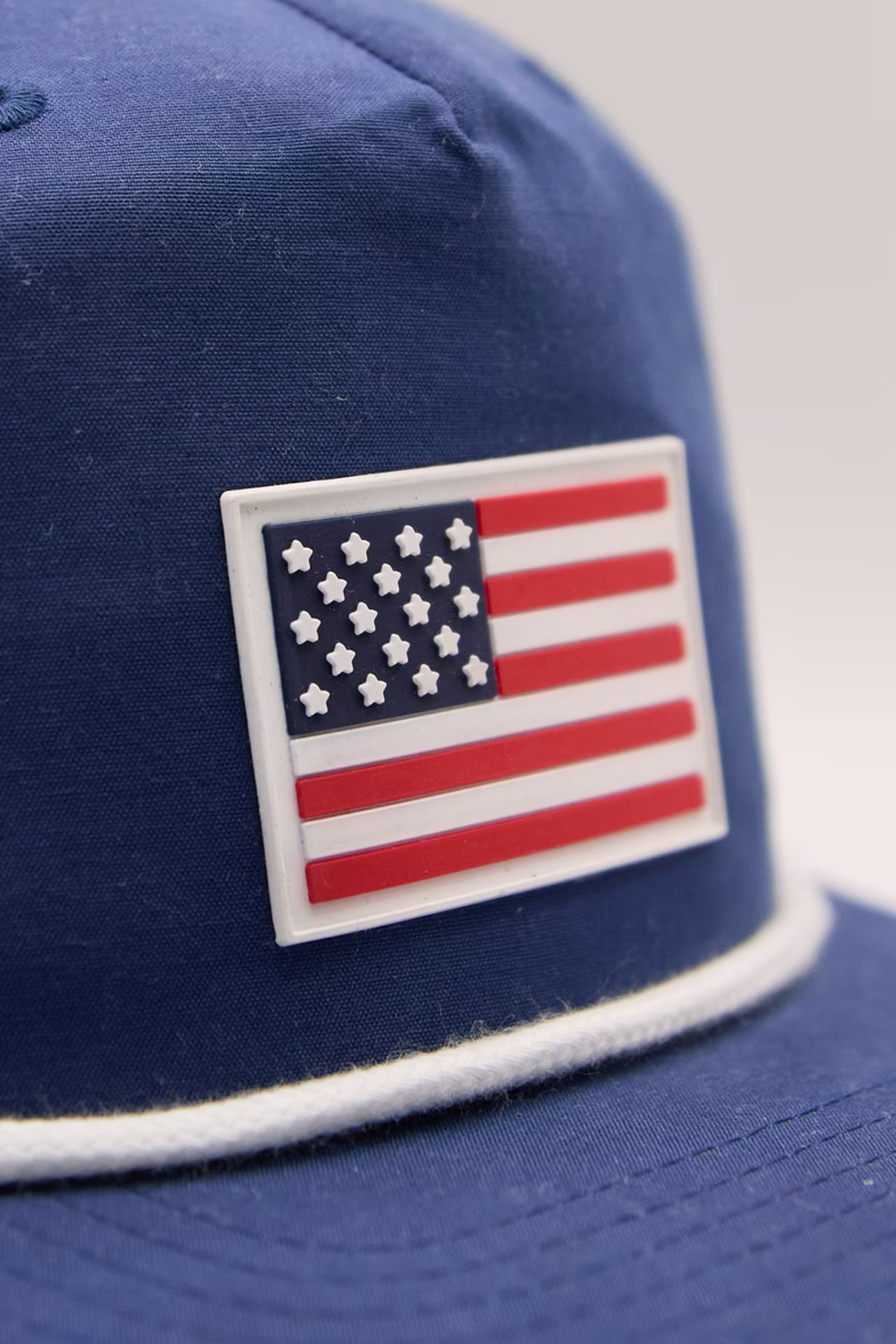 a molded American flag patch on a blue hat