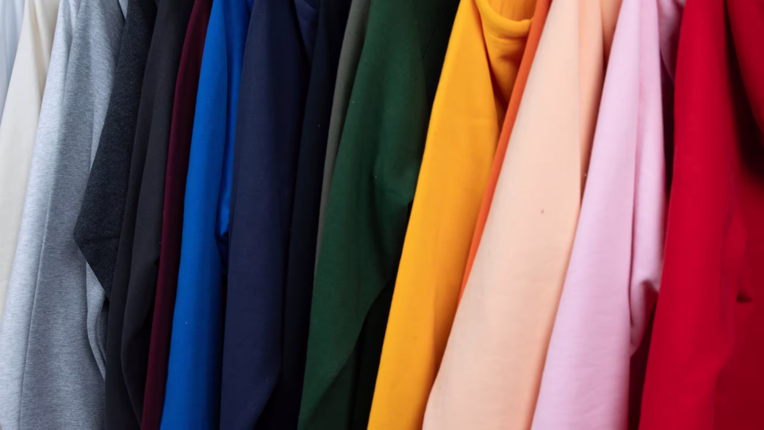 an assorted color of hoodies